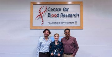 Recipients of the Logan Boulet Humanitarian Award 2021 holding the award. (Left to right: Daniel Luo, Dr. Erika Siren, Dr. Jayachandran Kizhakkedathu)